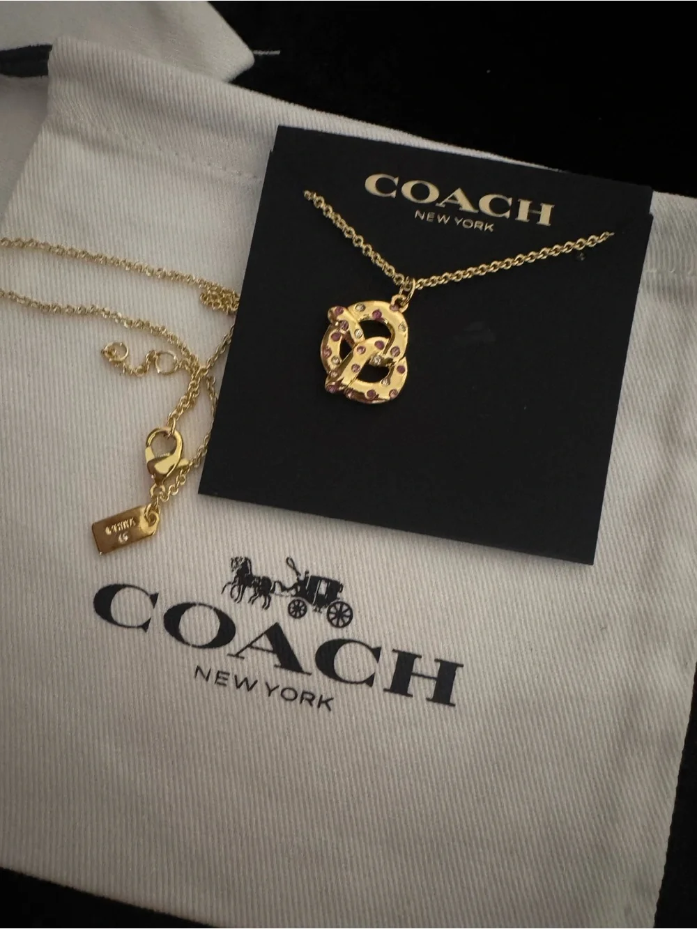 Coach Gold Pretzel Pendant Necklace with Pink Accents